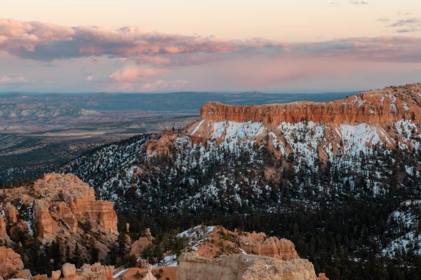 bryce from sunrise point at bryce at sunset with pink and blue clouds