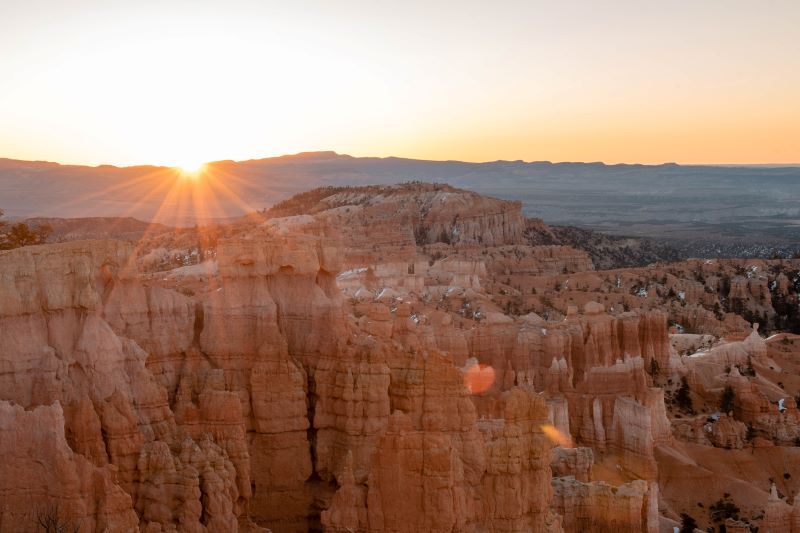 view of bryce national park hoodoos at sunrise, one of the best scenic drives around the world for a road trip