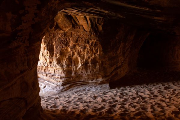 light shining into the sandstone cave accessible by hike