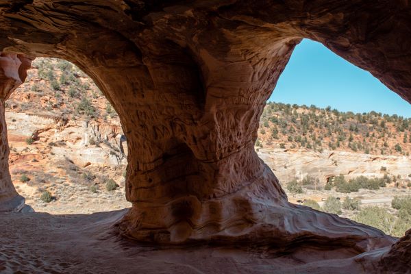 Utah cave of sandstone overlooking desert views in Kanab