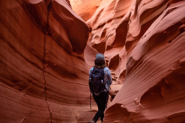 girl hiking through antelope canyon in Page, Arizona