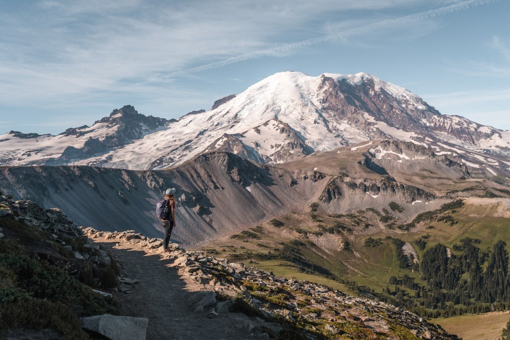 girl looking up at Mount Rainier on a day hike