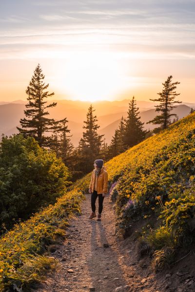 girl wearing hiking travel essentials in pacific northwest