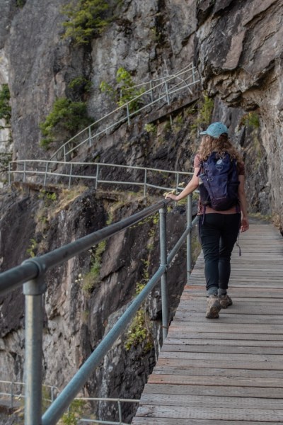 girl hiking with backpack on boardwalk on Beacon Rock Trail near Hood River