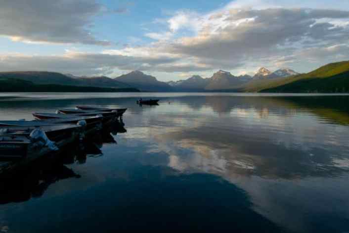 a pier with boats on Lake McDonald in Glacier National Park