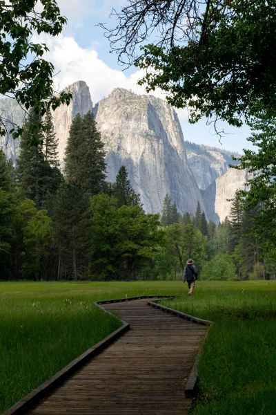 view of Yosemite Valley man on wooden path