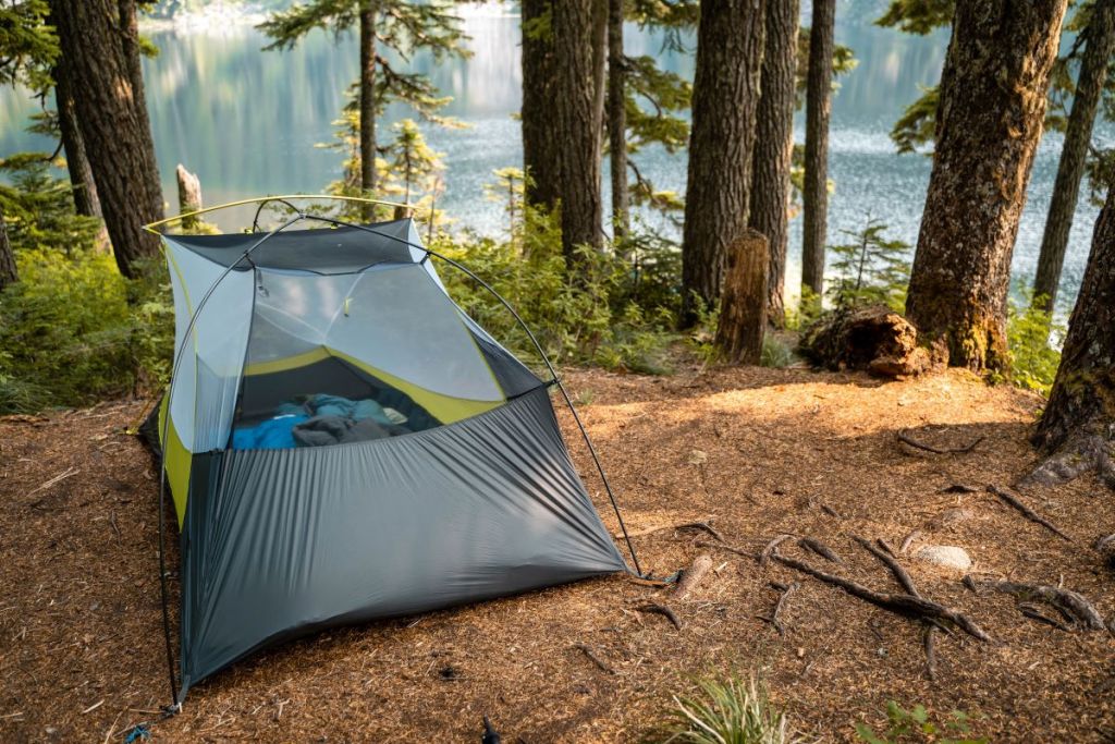 camping tent gear in forest