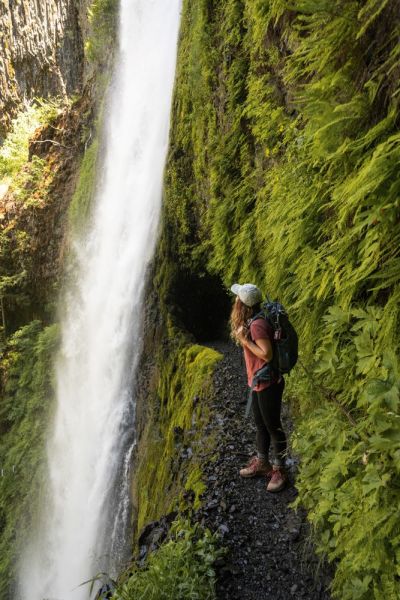 girl wearing hiking clothes to a waterfall