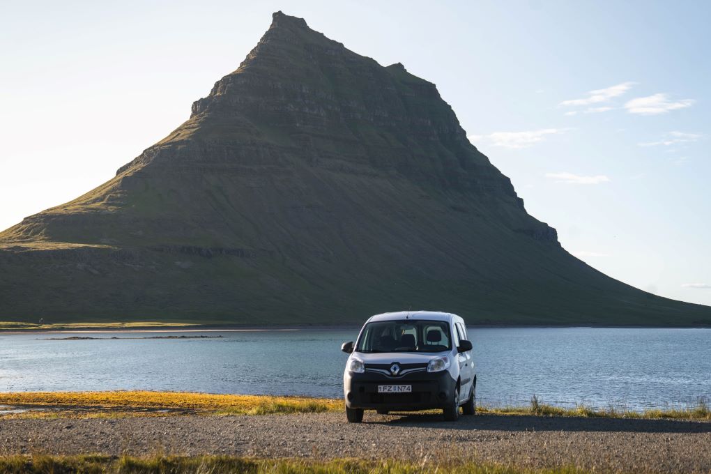 iceland campervan in front of a lake and mountain